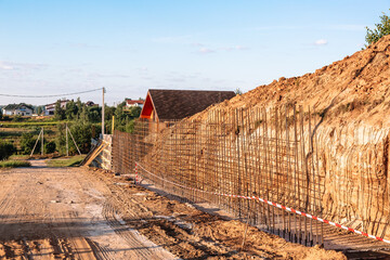 The construction of a retaining wall or counterfort, formwork, reinforced, preparation to pour...