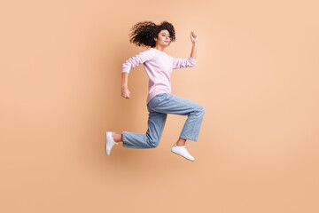 Fototapeta na wymiar Full length profile portrait of attractive active person running look curious isolated on brown color background