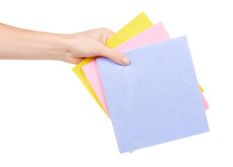 Hand with colored cleaning rag isolated on white background.