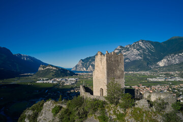Obraz premium Flying on drone, aerial view of Arco Castle ruins, Lake Garda. Italy. Arco Medieval Castle on the top of the rock.