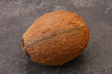 Tropical brown coconut over background