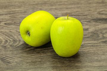 Two ripe green sweet apples