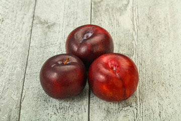 Ripe sweet plum fruit heap
