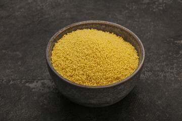 Raw cous cous heap in the bowl