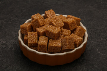 Cane sugar cubs in the bowl