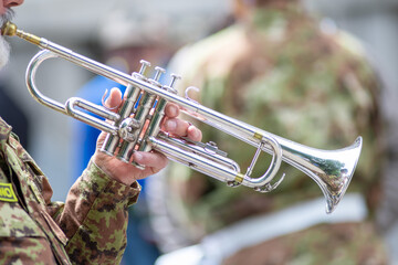 Detail of a trumpet played by a soldier during a parade