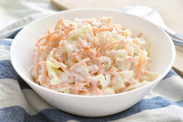 Coleslaw salad with carrot and cabbage.