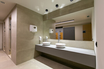 Bathroom interior in gym fitness center