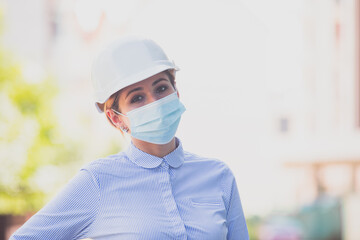 Warm look of young realtor over medical mask