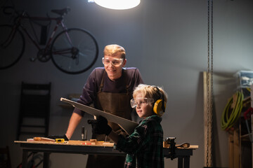 the older brother helped the younger one make weapons out of wood and the younger one plays in the carpentry shop