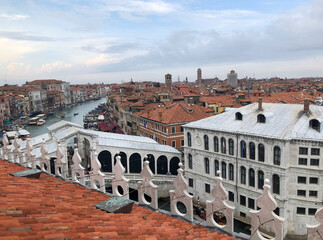 Fototapeta na wymiar Buildings and Rialto Bridge along the Grand Canal in Venice, Italy