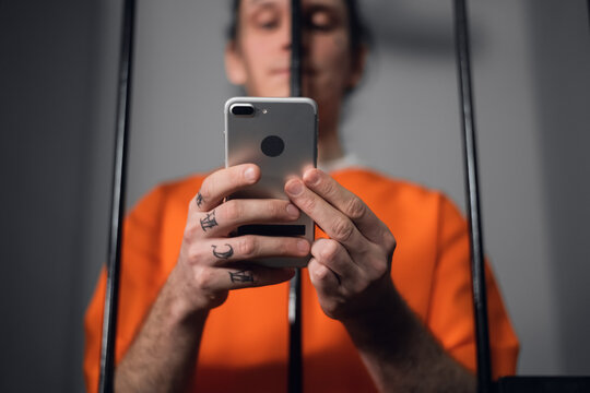 The criminal in the prison cell received a smartphone to communicate with relatives