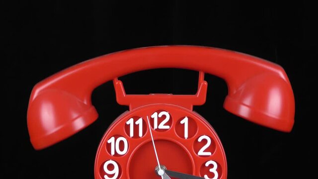 Telefono orologio rosso con dondolio della cornetta.