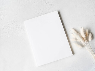 White magazine cover mockup and dry branches