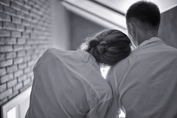 couple in love at home view from the back, man and woman relationship concept