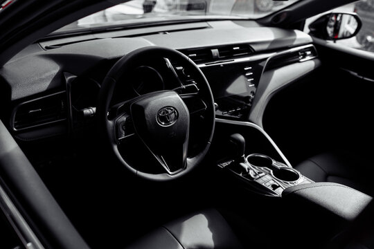 RIVNE, UKRAINE - OCTOBER 27, 2019: Toyota - luxury new car Interior - steering wheel, driver seats, multimedia system and dashboard