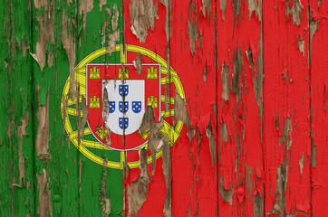 Flag of Portugal on a weathered wooden wall