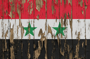 Flag of Syria on a weathered wooden wall
