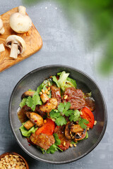 beef salad with mushrooms, pine nuts and tomatoes. salad with ingredients top view