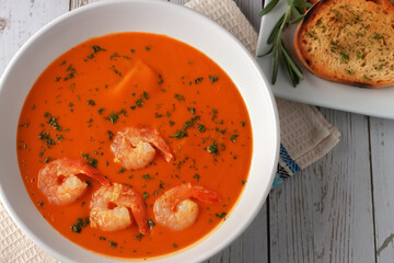 Bean puree soup with tomatoes, shrimps and rosemary. Diet food.