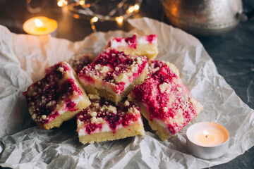Delicious pie with raspberries and curd cheese. Pieces of pie on the table