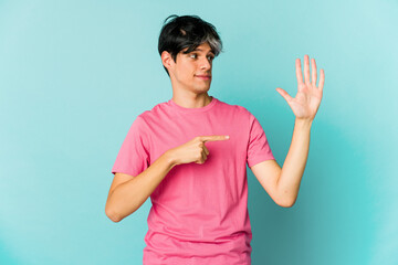 Young caucasian skinny man expressing emotions isolated on blue background
