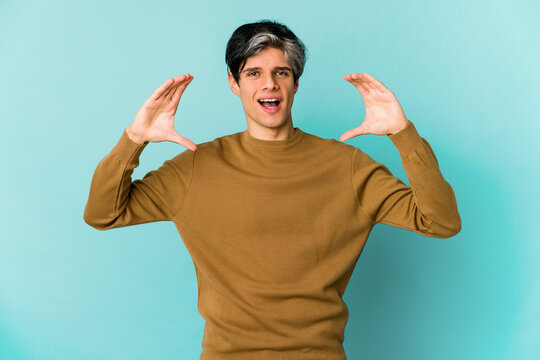 Young caucasian skinny man expressing emotions isolated on blue background