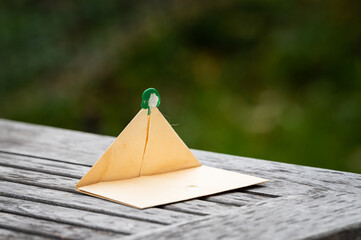 Open brown paper envelope lying on a table