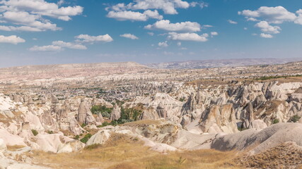 Fototapeta premium Red Valley and Rose Valley of Goreme of Nevsehir in Cappadocia aerial timelapse, Turkey.