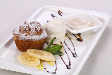 Tasty hot muffin with ice cream