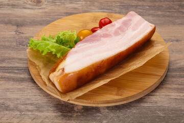Smoked pork breast with salad leaves