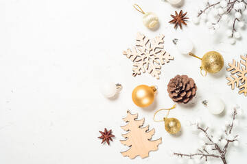 Winter fir tree with snow and decorations at white table.