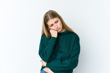 Young blonde woman isolated on white background who feels sad and pensive, looking at copy space.