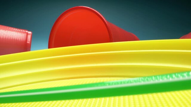 extreme close-up, detailed. set of multicolored plastic dishes on a blue background