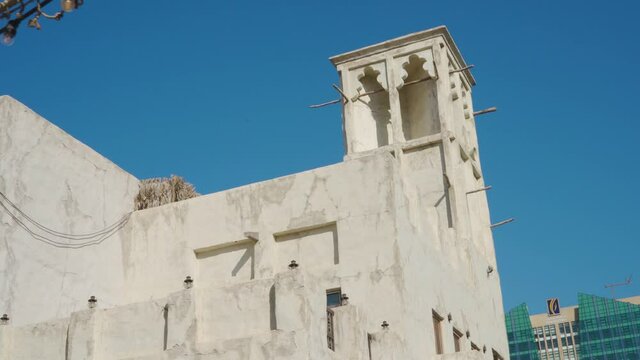 Building With Wind Tower Against Blue Sky - Al Fahidi Historical District In Dubai - low angle