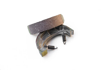 Motorcycle brake pads on white background.
