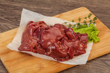 Raw chicken liver over board