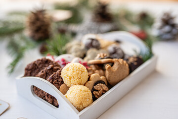 Close up of christmas cakes and cookies with santa hat 