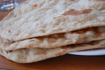 Close up of naan bread can represent food or food industry or baking