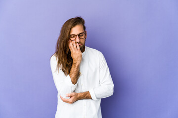 Young man with long hair look who is bored, fatigued and need a relax day.
