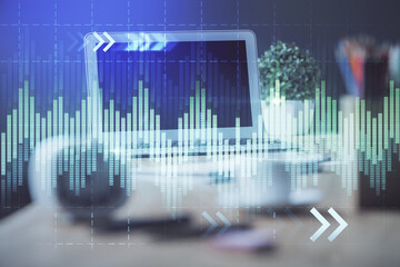 Stock market chart hologram drawn on personal computer background. Multi exposure. Concept of investment.