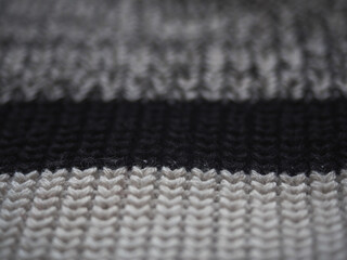 Macro snapshot of knitted texture. Warm sweater. Fashion and texture concept