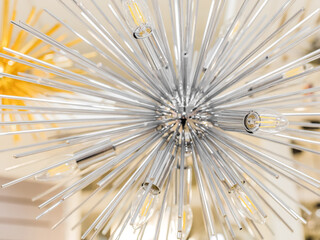 Close-up of a switched off incandescent lamp in a ceiling with a clear glass chandelier in the form of a modern style tube. The concept of decor for the interior. Indoors. The rectangular image size.