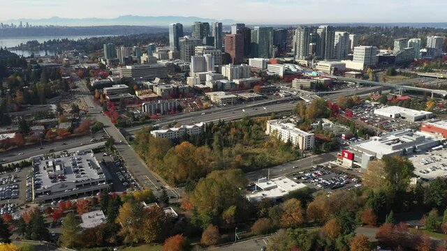 Birdseye footage of Bellevue, Washington downtown with residential and commercial highrise buildings along Interstate highway 405 in King County