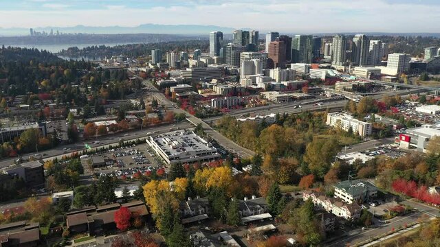 Aerial / drone footage of Meydenbauer Bay, Whalers Cove, Bellevue, Washington downtown with residential and commercial highrise buildings along Interstate highway 405 in King County