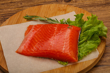 Salmon piece steak served rosemary