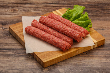 Raw beef sausages with spices