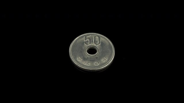 Japan 50 Yen coin macro isolated shot, coined in Heisei 9 or 1997