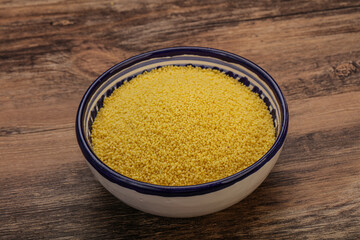 Raw cous cous heap in the bowl