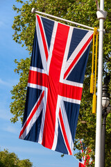 Fototapeta na wymiar Real Union Jack flag flying outside from post, London, UK